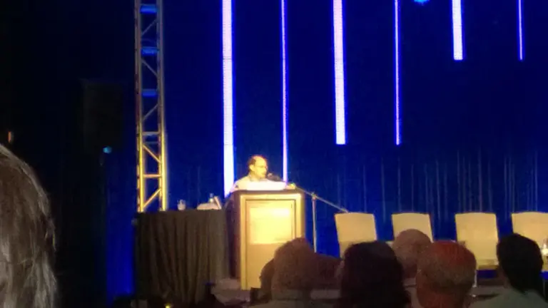 Valerie Varan speaking on stage